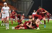 7 May 2021; JJ Hanrahan of Munster is congratulated by team-mates after scoring their side's fifth try during the Guinness PRO14 Rainbow Cup match between Munster and Ulster at Thomond Park in Limerick. Photo by Ramsey Cardy/Sportsfile