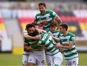 8 May 2021; Danny Mandroiu of Shamrock Rovers, centre, celebrates with team-mates including Lee Grace, top, after scoring his side's second goal with team-mates during the SSE Airtricity League Premier Division match between St Patrick's Athletic and Shamrock Rovers at Richmond Park in Dublin. Photo by Harry Murphy/Sportsfile