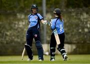 9 May 2021; Orla Prendergast of Typhoons fist bumps her batting partner Maria Kerrison as she reaches 100 during the third match of the Arachas Super 50 Cup between Scorchers and Typhoons at Rush Cricket Club in Rush, Dublin. Photo by Harry Murphy/Sportsfile