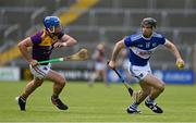 9 May 2021; PJ Scully of Laois in action against Conor Firman of Wexford during the Allianz Hurling League Division 1 Group B Round 1 match between Wexford and Laois at Chadwicks Wexford Park in Wexford. Photo by Brendan Moran/Sportsfile