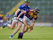 9 May 2021; Conal Flood of Wexford in action against Paddy Purcell of Laois during the Allianz Hurling League Division 1 Group B Round 1 match between Wexford and Laois at Chadwicks Wexford Park in Wexford. Photo by Brendan Moran/Sportsfile