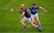 9 May 2021; Simon Donohoe of Wexford in action against PJ Scully of Laois during the Allianz Hurling League Division 1 Group B Round 1 match between Wexford and Laois at Chadwicks Wexford Park in Wexford. Photo by Brendan Moran/Sportsfile