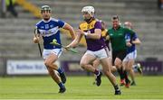 9 May 2021; Rory O'Connor of Wexford in action against James Ryan of Laois during the Allianz Hurling League Division 1 Group B Round 1 match between Wexford and Laois at Chadwicks Wexford Park in Wexford. Photo by Brendan Moran/Sportsfile