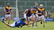 9 May 2021; Mikie Dwyer of Wexford is tackled by Lee Cleere of Laois during the Allianz Hurling League Division 1 Group B Round 1 match between Wexford and Laois at Chadwicks Wexford Park in Wexford. Photo by Brendan Moran/Sportsfile