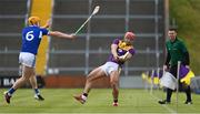 9 May 2021; Lee Chin of Wexford in action against Podge Delaney of Laois during the Allianz Hurling League Division 1 Group B Round 1 match between Wexford and Laois at Chadwicks Wexford Park in Wexford. Photo by Brendan Moran/Sportsfile