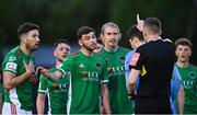 14 May 2021; Cork City players, from left, Gearoid Morrissey, Jack Baxter, Gordon Walker, and Jonas Häkkinen remonstrate with referee Oliver Moran after Morrissey was shown a yellow card during the SSE Airtricity League First Division match between UCD and Cork City at UCD Bowl in Belfield, Dublin. Photo by Piaras Ó Mídheach/Sportsfile