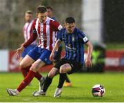 14 May 2021; James Doona of Athlone Town in action against Jack Lynch of Treaty United during the SSE Airtricity League First Division match between Treaty United and Athlone Town at Markets Field in Limerick. Photo by Michael P Ryan/Sportsfile