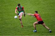 15 May 2021; Fionn McDonagh of Mayo scores a point under pressure from Patrick Murdock of Down during the Allianz Football League Division 2 North Round 1 match between Mayo and Down at Elverys MacHale Park in Castlebar, Mayo. Photo by Piaras Ó Mídheach/Sportsfile