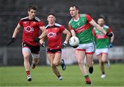15 May 2021; Matthew Ruane of Mayo in action against Conor Poland of Down during the Allianz Football League Division 2 North Round 1 match between Mayo and Down at Elverys MacHale Park in Castlebar, Mayo. Photo by Piaras Ó Mídheach/Sportsfile
