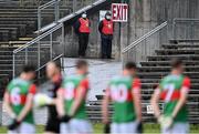 15 May 2021; Two stewards look on as the Mayo players get in position for the playing of Amhrán na bhFiann before the Allianz Football League Division 2 North Round 1 match between Mayo and Down at Elverys MacHale Park in Castlebar, Mayo. Photo by Piaras Ó Mídheach/Sportsfile