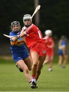 15 May 2021; Ali Smith of Cork in action against Ciara Ryan of Tipperary during the Littlewoods Ireland National Camogie League Division 2 Group 2 match between Tipperary and Cork at Drom-Inch in Tipperary. Photo by David Fitzgerald/Sportsfile