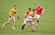 15 May 2021; Ruairi McCann of Antrim in action against Liam Jackson of Louth during the Allianz Football League Division 4 North Round 1 match between Louth and Antrim at Geraldines Club in Haggardstown, Louth. Photo by Ramsey Cardy/Sportsfile