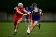 15 May 2021; Jill Ann Quirke of Tipperary in action against Emma Flanagan of Cork during the Littlewoods Ireland National Camogie League Division 2 Group 2 match between Tipperary and Cork at Drom-Inch in Tipperary. Photo by David Fitzgerald/Sportsfile