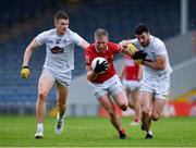 15 May 2021; Ruairí Deane of Cork is tackled by Kevin Feely, left, and Kevin Flynn of Kildare during the Allianz Football League Division 2 South Round 1 match between Cork and Kildare at Semple Stadium in Thurles, Tipperary. Photo by Ray McManus/Sportsfile