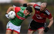 15 May 2021; Tommy Conroy of Mayo in action against Patrick Murdock of Down during the Allianz Football League Division 2 North Round 1 match between Mayo and Down at Elverys MacHale Park in Castlebar, Mayo. Photo by Piaras Ó Mídheach/Sportsfile