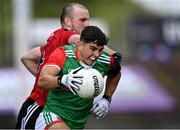 15 May 2021; Tommy Conroy of Mayo in action against Patrick Murdock of Down during the Allianz Football League Division 2 North Round 1 match between Mayo and Down at Elverys MacHale Park in Castlebar, Mayo. Photo by Piaras Ó Mídheach/Sportsfile