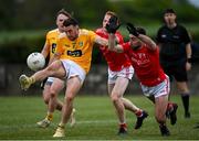 15 May 2021; Conor Murray of Antrim shoots under pressure from Donal McKenny, centre, and Eoghan Callaghan of Louth during the Allianz Football League Division 4 North Round 1 match between Louth and Antrim at Geraldines Club in Haggardstown, Louth. Photo by Ramsey Cardy/Sportsfile