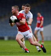 15 May 2021; Ruairí Deane of Cork is tackled by Kevin Feely of Kildare during the Allianz Football League Division 2 South Round 1 match between Cork and Kildare at Semple Stadium in Thurles, Tipperary. Photo by Ray McManus/Sportsfile