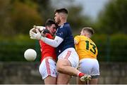 15 May 2021; Louth goalkeeper Martin McEneaney, centre, and Emmet Carolan in action against Odhran Eastwood of Antrim during the Allianz Football League Division 4 North Round 1 match between Louth and Antrim at Geraldines Club in Haggardstown, Louth. Photo by Ramsey Cardy/Sportsfile