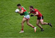 15 May 2021; Tommy Conroy of Mayo is tackled by Gerard Collins of Down during the Allianz Football League Division 2 North Round 1 match between Mayo and Down at Elverys MacHale Park in Castlebar, Mayo. Photo by Piaras Ó Mídheach/Sportsfile