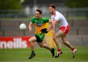 15 May 2021; Hugh McFadden of Donegal in action against Brian Kennedy of Tyrone during the Allianz Football League Division 1 North Round 1 match between Tyrone and Donegal at Healy Park in Omagh, Tyrone. Photo by Stephen McCarthy/Sportsfile