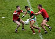 15 May 2021; Tommy Conroy of Mayo is tackled by James Guinness, left, and Gerard Collins of Down during the Allianz Football League Division 2 North Round 1 match between Mayo and Down at Elverys MacHale Park in Castlebar, Mayo. Photo by Piaras Ó Mídheach/Sportsfile