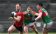 15 May 2021; Gerard McGovern of Down in action against Eoghan McLaughlin, 21, and Cillian O'Connor of Mayo during the Allianz Football League Division 2 North Round 1 match between Mayo and Down at Elverys MacHale Park in Castlebar, Mayo. Photo by Piaras Ó Mídheach/Sportsfile