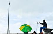 15 May 2021; Kerry supporters celebrate their side's third goal, scored by David Clifford, as they shelter from the rain while watching the Allianz Football League Division 1 South Round 1 match between Kerry and Galway at Austin Stack Park in Tralee, Kerry. Photo by Brendan Moran/Sportsfile