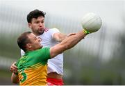 15 May 2021; Neil McGee of Donegal in action against Conor McKenna of Tyrone during the Allianz Football League Division 1 North Round 1 match between Tyrone and Donegal at Healy Park in Omagh, Tyrone. Photo by Stephen McCarthy/Sportsfile