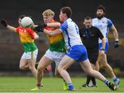 15 May 2021; Ross Dunphy of Carlow in action against Michael Curry of Waterford during the Allianz Football League Division 3 North Round 1 match between Waterford and Carlow at Fraher Field in Dungarvan, Waterford. Photo by Matt Browne/Sportsfile