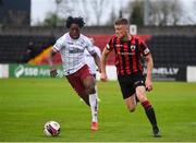 15 May 2021; Michael McDonnell of Longford Town in action against Promise Omochere of Bohemians during the SSE Airtricity League Premier Division match between Longford Town and Bohemians at Bishopsgate in Longford. Photo by Ben McShane/Sportsfile