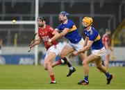 15 May 2021; Niall Cashman of Cork in action against Jason Forde, left, and Barry Heffernan of Tipperary during the Allianz Hurling League Division 1 Group A Round 2 match between Tipperary and Cork at Semple Stadium in Thurles, Tipperary. Photo by Daire Brennan/Sportsfile