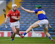 15 May 2021; Patrick Horgan of Cork rounds the Tipperary full back Brian McGrath to score a goal, in the 44th minute, during the Allianz Hurling League Division 1 Group A Round 2 match between Tipperary and Cork at Semple Stadium in Thurles, Tipperary. Photo by Ray McManus/Sportsfile