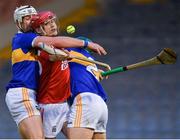 15 May 2021; Alan Connolly of Cork is tackled by Tipperary players Padraic Maher, left, and Cathal Barrett during the Allianz Hurling League Division 1 Group A Round 2 match between Tipperary and Cork at Semple Stadium in Thurles, Tipperary. Photo by Ray McManus/Sportsfile