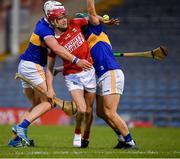 15 May 2021; Alan Connolly of Cork is tackled by Tipperary players Padraic Maher, left, and Cathal Barrett during the Allianz Hurling League Division 1 Group A Round 2 match between Tipperary and Cork at Semple Stadium in Thurles, Tipperary. Photo by Ray McManus/Sportsfile