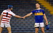 15 May 2021; John McGrath of Tipperary fist bumps Patrick Collins of Cork after the Allianz Hurling League Division 1 Group A Round 2 match between Tipperary and Cork at Semple Stadium in Thurles, Tipperary. Photo by Daire Brennan/Sportsfile