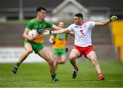 15 May 2021; Michael Langan of Donegal in action against Michael Cassidy of Tyrone during the Allianz Football League Division 1 North Round 1 match between Tyrone and Donegal at Healy Park in Omagh, Tyrone. Photo by Stephen McCarthy/Sportsfile
