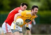 15 May 2021; Ruairi McCann of Antrim is tackled by Ciaran Keenan of Louth during the Allianz Football League Division 4 North Round 1 match between Louth and Antrim at Geraldines Club in Haggardstown, Louth. Photo by Ramsey Cardy/Sportsfile