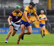 16 May 2021; Cathal Malone of Clare is tackled by Matthew O'Hanlon of Wexford during the Allianz Hurling League Division 1 Group B Round 2 match between Clare and Wexford at Cusack Park in Ennis, Clare. Photo by Ray McManus/Sportsfile