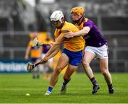 16 May 2021; Diarmuid Ryan of Clare is tackled by Simon Donohoe of Wexford during the Allianz Hurling League Division 1 Group B Round 2 match between Clare and Wexford at Cusack Park in Ennis, Clare. Photo by Ray McManus/Sportsfile
