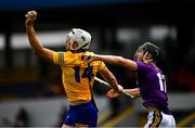 16 May 2021; Aaron Shanagher of Clare is tackled by Joe O'Connor of Wexford during the Allianz Hurling League Division 1 Group B Round 2 match between Clare and Wexford at Cusack Park in Ennis, Clare. Photo by Ray McManus/Sportsfile