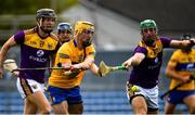 16 May 2021; Mark Rogers of Clare fires in a shot under pressure from Matthew O'Hanlon of Wexford during the Allianz Hurling League Division 1 Group B Round 2 match between Clare and Wexford at Cusack Park in Ennis, Clare. Photo by Ray McManus/Sportsfile