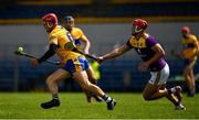 16 May 2021; John Conlon of Clare is tackled by Lee Chin of Wexford during the Allianz Hurling League Division 1 Group B Round 2 match between Clare and Wexford at Cusack Park in Ennis, Clare. Photo by Ray McManus/Sportsfile