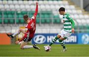 15 May 2021; Danny Mandroiu of Shamrock Rovers in action against Ciaron Harkin of Derry City during the SSE Airtricity League Premier Division match between Shamrock Rovers and Derry City at Tallaght Stadium in Dublin. Photo by Seb Daly/Sportsfile