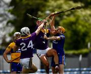 16 May 2021; The Clare goalkeeper Eibhear Quilligan catches the sliothar under pressure from Wexford players Rory O'Connor and Lee Chin during the Allianz Hurling League Division 1 Group B Round 2 match between Clare and Wexford at Cusack Park in Ennis, Clare. Photo by Ray McManus/Sportsfile