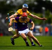16 May 2021; Conor Hearne of Wexford is tackled by Aidan McCarthy of Clare during the Allianz Hurling League Division 1 Group B Round 2 match between Clare and Wexford at Cusack Park in Ennis, Clare. Photo by Ray McManus/Sportsfile