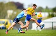 16 May 2021; Enda Smith of Roscommon in action against Colm Basquel of Dublin during the Allianz Football League Division 1 South Round 1 match between Roscommon and Dublin at Dr Hyde Park in Roscommon. Photo by Stephen McCarthy/Sportsfile