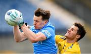 16 May 2021; Dara Mullin of Dublin is tackled by Fergal Lennon of Roscommon during the Allianz Football League Division 1 South Round 1 match between Roscommon and Dublin at Dr Hyde Park in Roscommon. Photo by Stephen McCarthy/Sportsfile