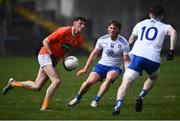 16 May 2021; Connaire Mackin of Armagh in action against Andrew Woods, centre, and Stephen O'Hanlon of Monaghan during the Allianz Football League Division 1 North Round 1 match between Monaghan and Armagh at Brewster Park in Enniskillen, Fermanagh. Photo by David Fitzgerald/Sportsfile