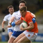 16 May 2021; Oisin O'Neill of Armagh in action against Dessie Ward of Monaghan during the Allianz Football League Division 1 North Round 1 match between Monaghan and Armagh at Brewster Park in Enniskillen, Fermanagh. Photo by Philip Fitzpatrick/Sportsfile